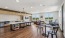 Large room with tables and kitchen