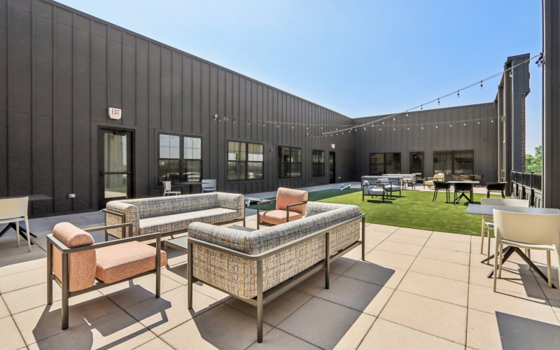 Outdoor lounge with furniture and string lights