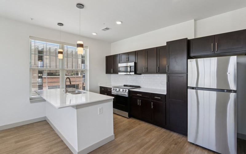 Kitchen with island and brown cabinets