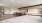 Large room with island and big area rug